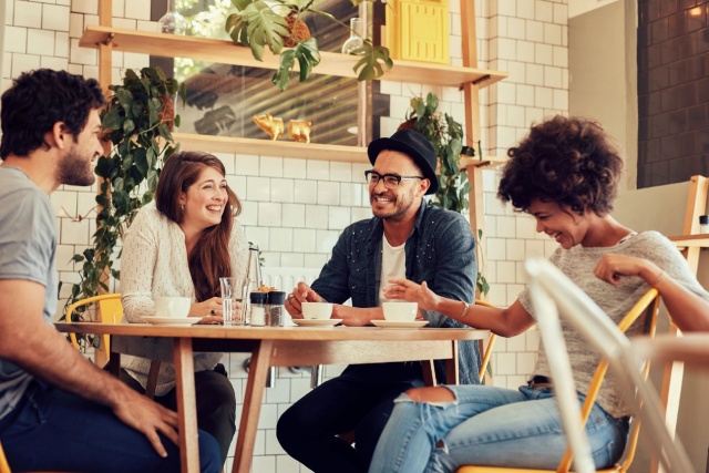 Four people sitting around a table